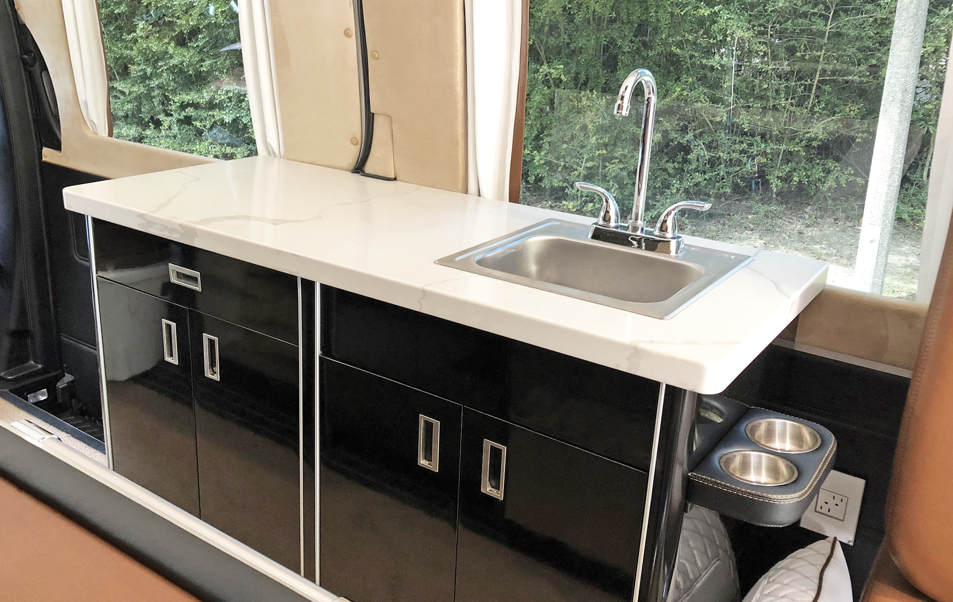Sink and Piano Black Cabinets